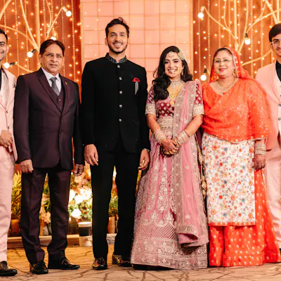 wedded couple posing for a shoot with extended family members