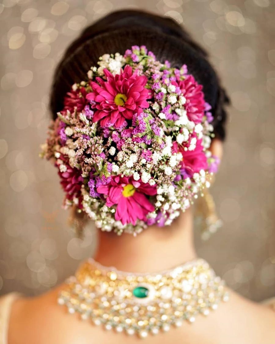 Trending Bridal Bun Hairstyle With Flowers For Wedding