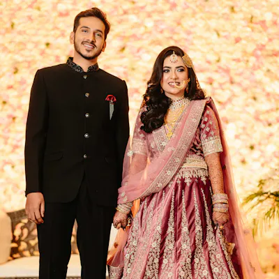 Bride and groom smiling at the camera