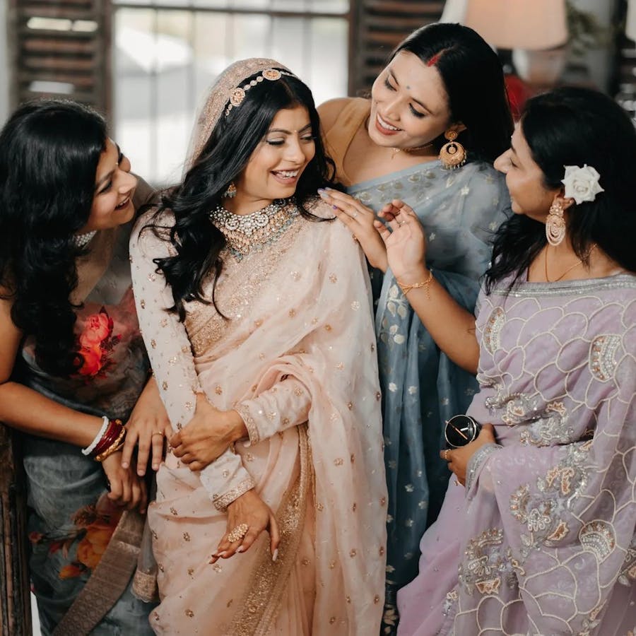 Bride laughing with her friends pic