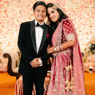 Bride posing with her younger brother