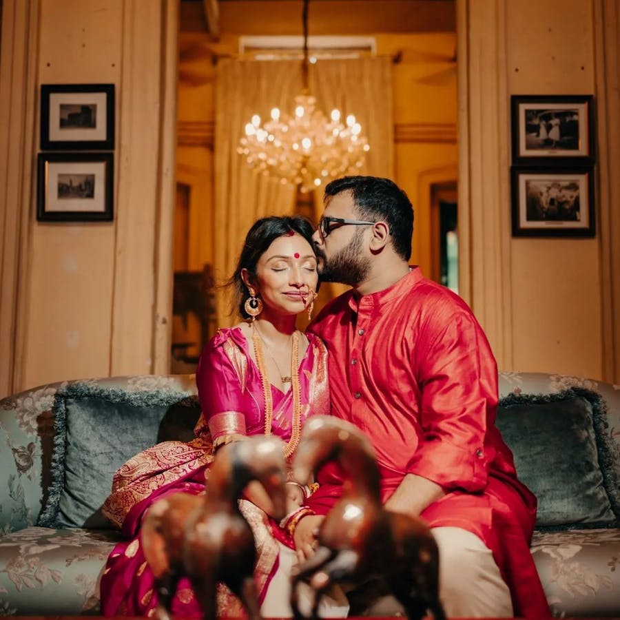 Groom kissing the forehead of his bride