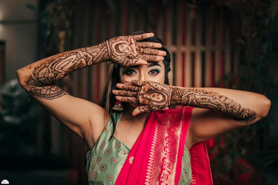 Pretty bride showing her mehndi