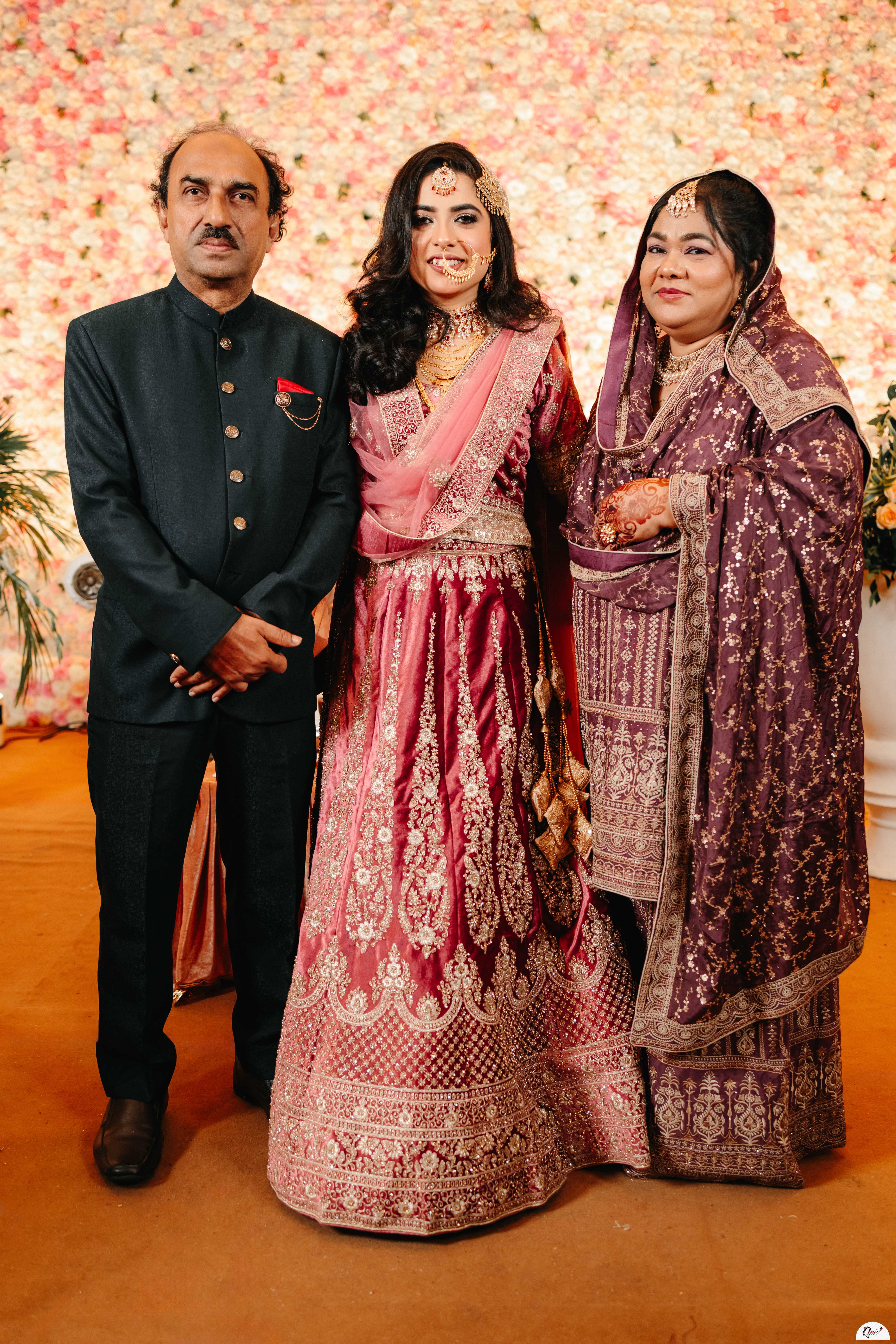 Bride with her parents at her Walima