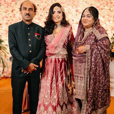 Bride with her parents at her Walima