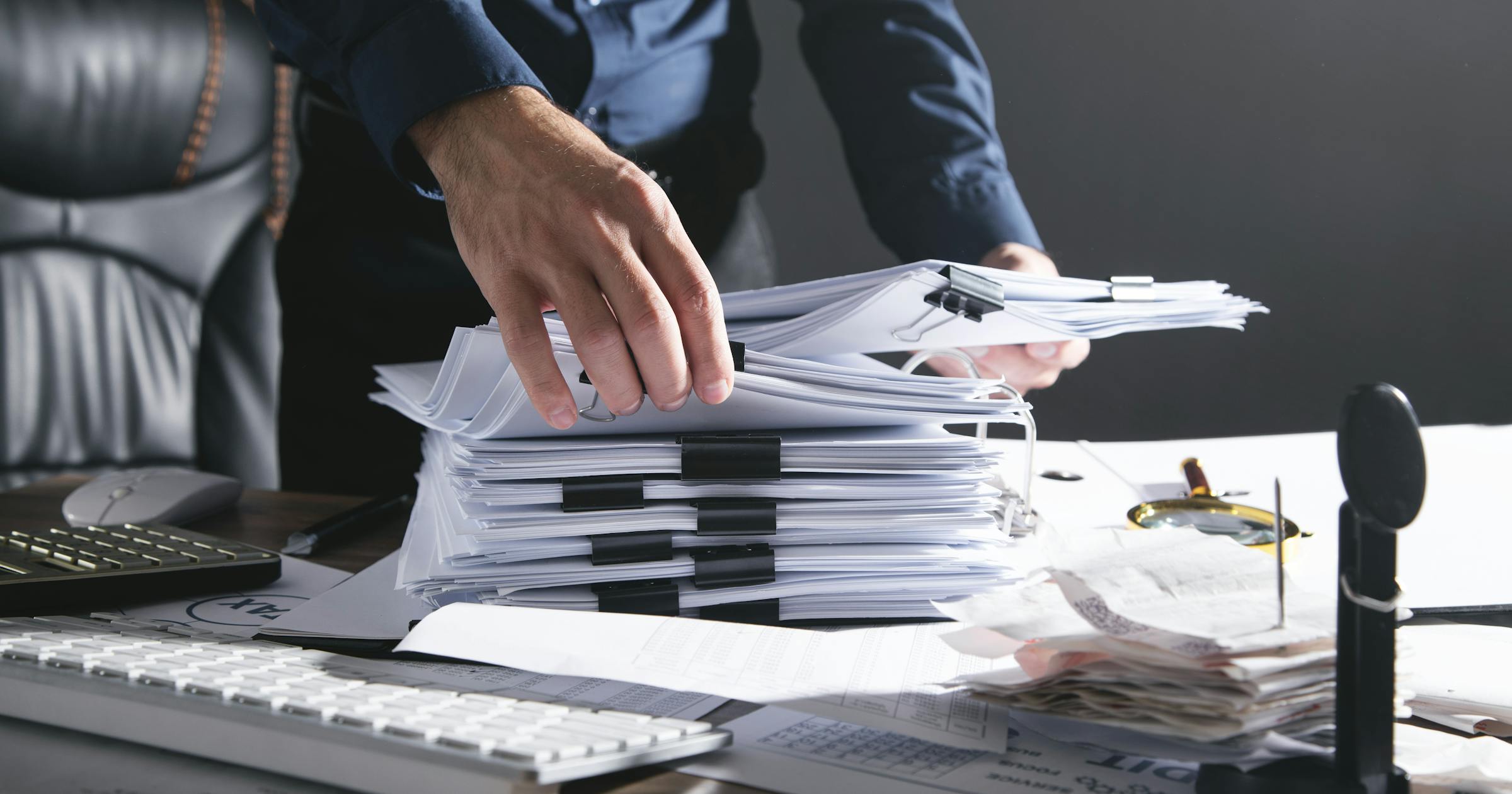 a big pile of documents being organised 