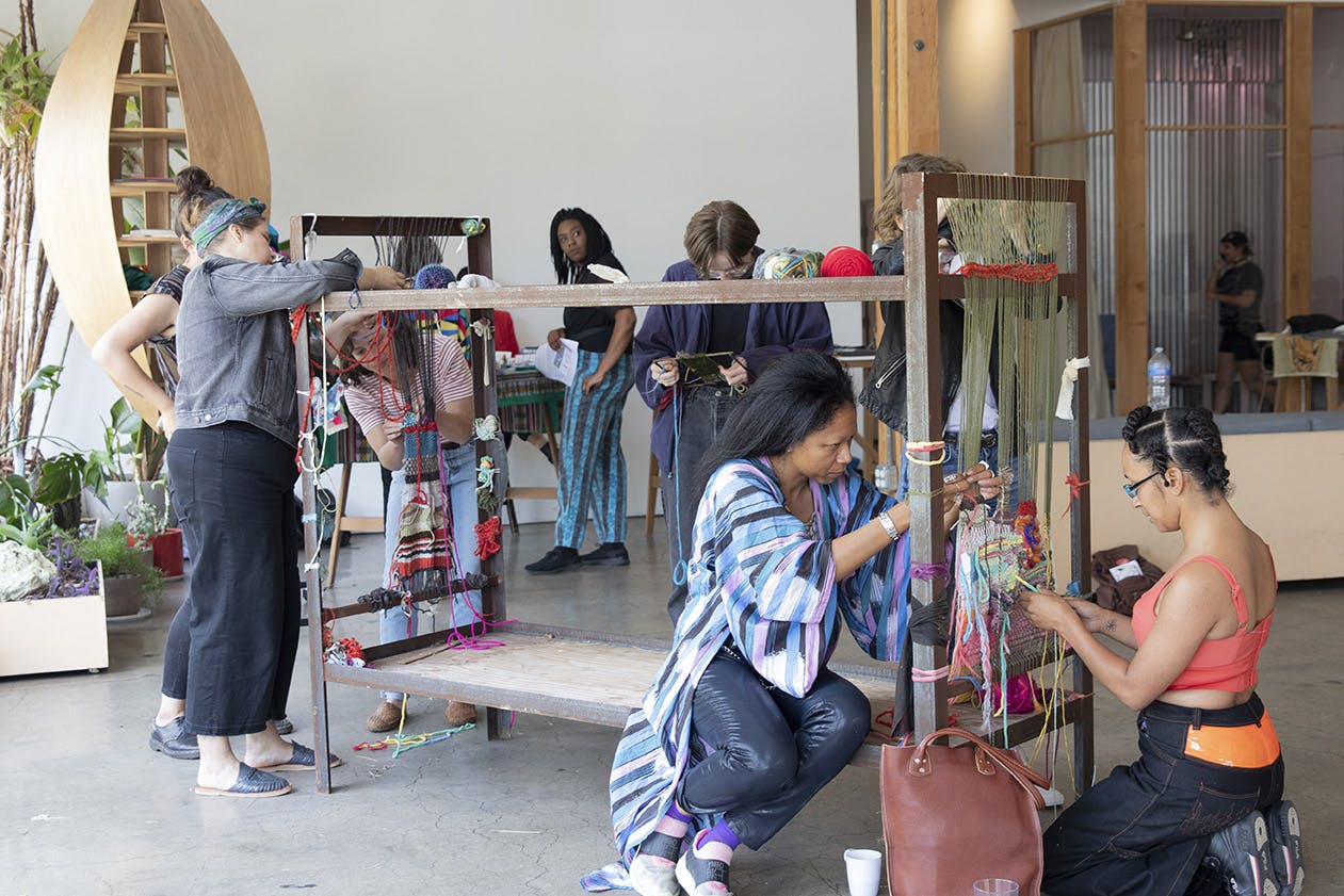 Attendees were invited to create work on a loom fashioned from a decommissioned jail bed at A Right to Defiance, a queer punk music festival curated by Jasmine Nyende on June 15, 2019