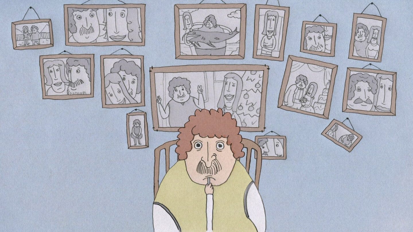 Still from Yearbook – a man eats an unimpressive meal in front of a wall of photos.