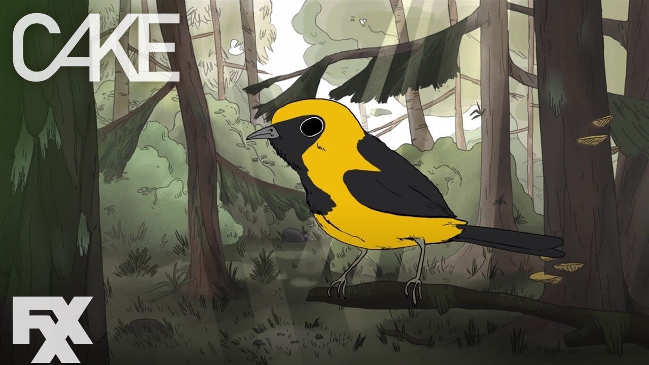 A yellow and black bird sits on a branch in the forest. Overlaid text says "Cake FXX"
