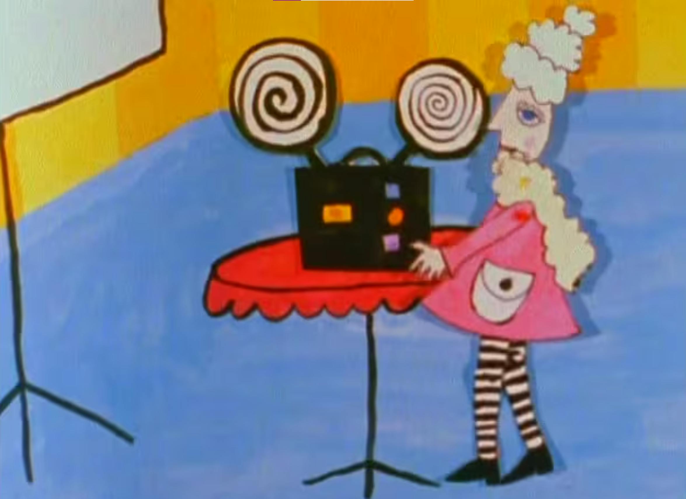 cut out animation puppet of Madame Winger, an older woman with tall poofy white hair, wearing a cream-coloured boa, a pink jacket with a light grey pocket, black and white striped tights and black shoes, standing at a red table and operating a film projector. She is in a room with blue floor, orange and yellow striped walls, and a projector screen to her left. 