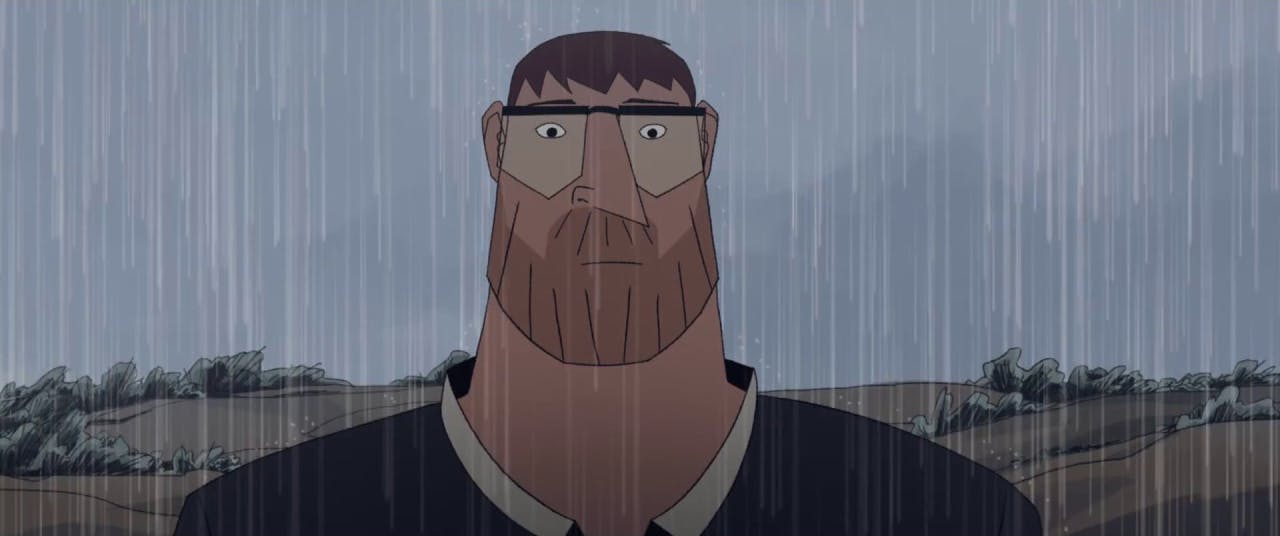 A man stands in the pouring rain, his face nearly expressionless.