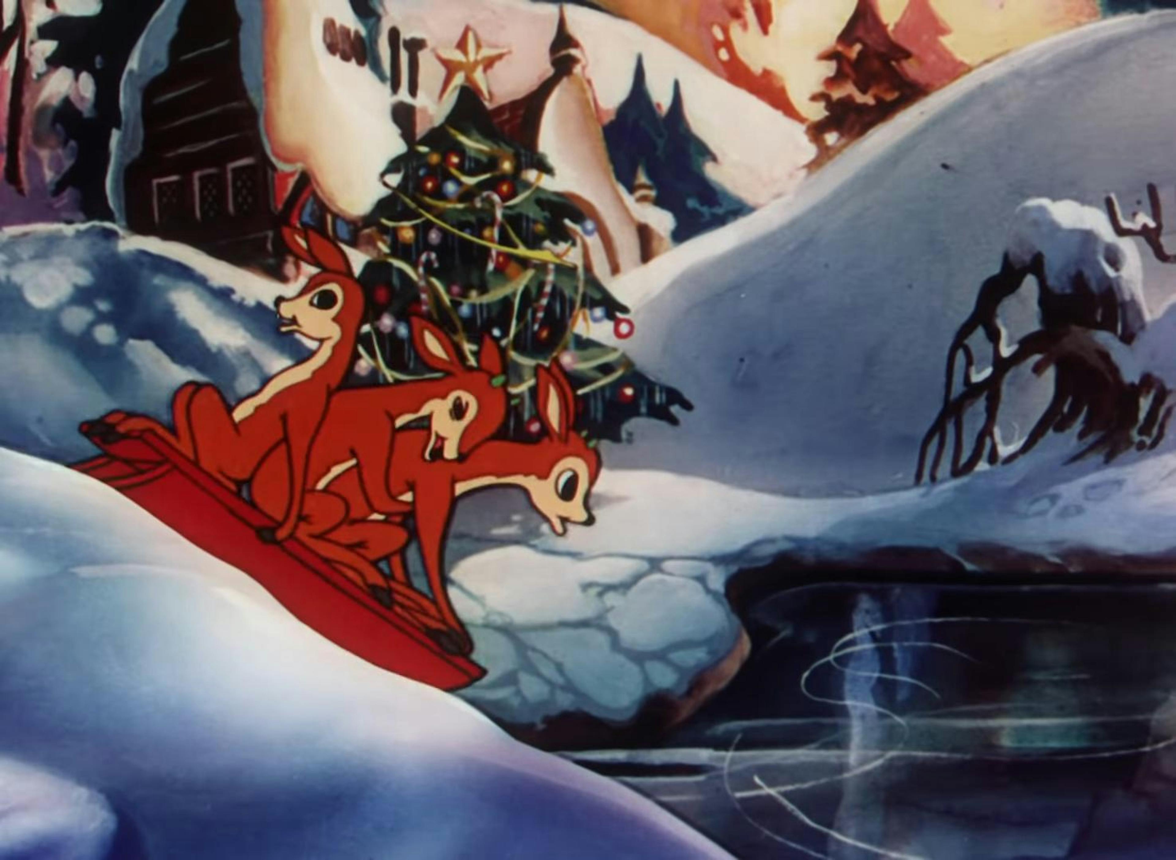 Three reindeer ride a sled towards a frozen pond, with Christmas trees and snow drifts in the background