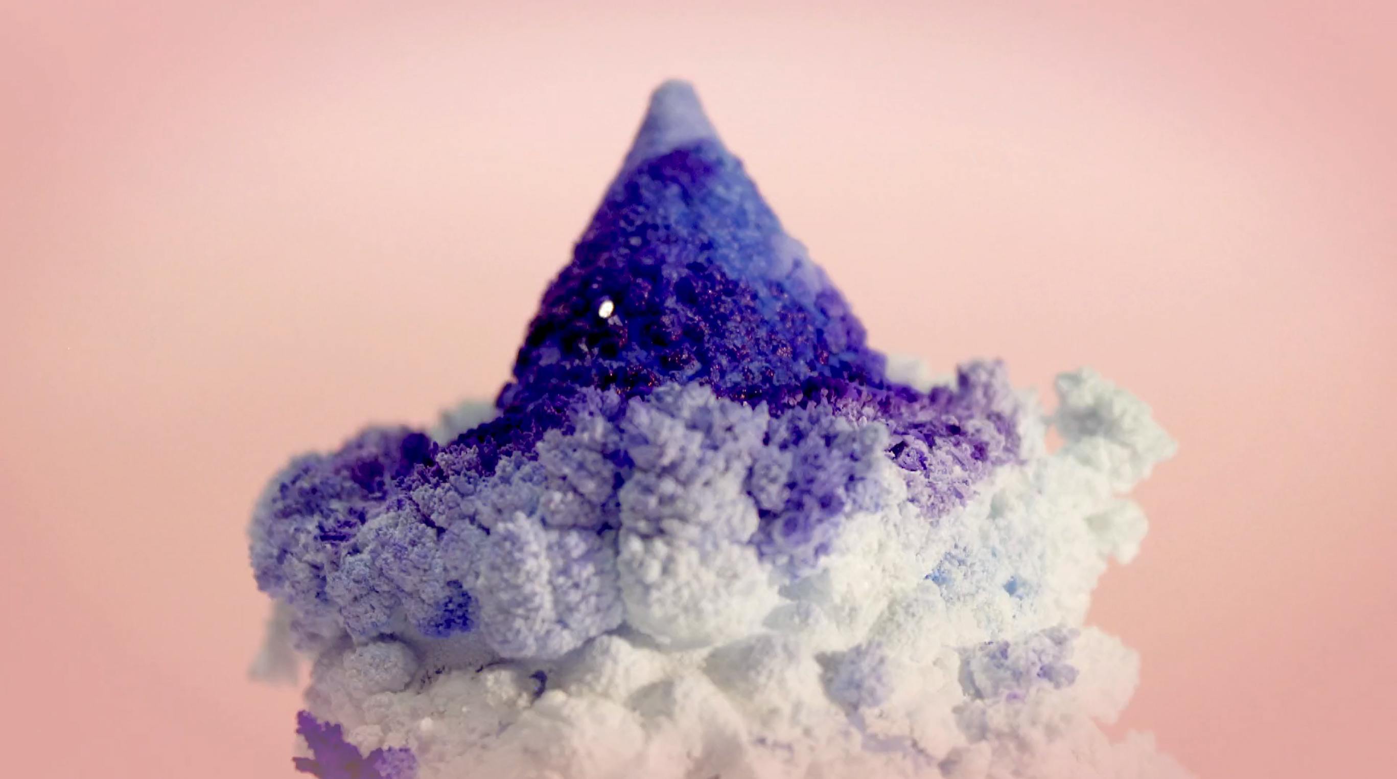 image of a cone with crystals growing on it