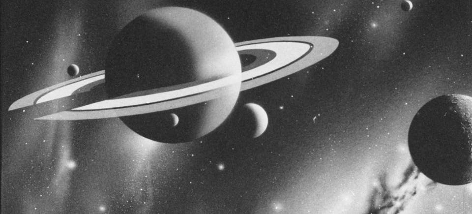 black and white image of Saturn in space, surrounded by its moons in a space-environment
The image looks 3d rendered