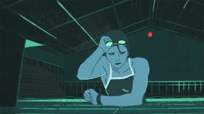 Screenshot from QUAND J’AI REMPLACÉ CAMILLE - Nathan Otaño, Rémy Clarke and Leïla Courtillon. IMage of a woman in a warehouse, wearing a work apron and looking at a wrist watch while she lifts safety goggles onto her face. The colour scheme is only blue and green hues