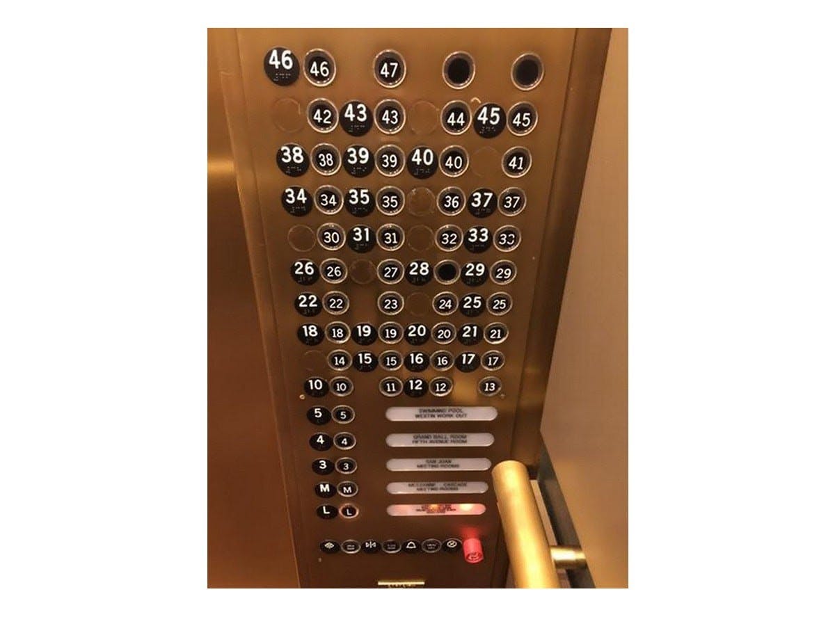buttons of an elevator, black button, silver-bronze layout