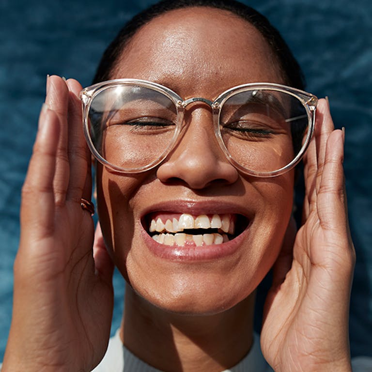 Smiling woman in glasses
