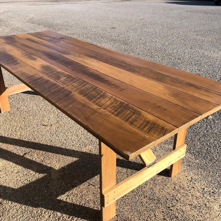 Wooden trestle table. 8x3ft trestle table great for banquets and sharing platters! These tables can sit up to ten people.