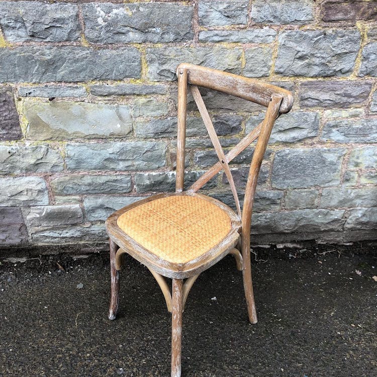 Oak cross back chairs with rattan seat.