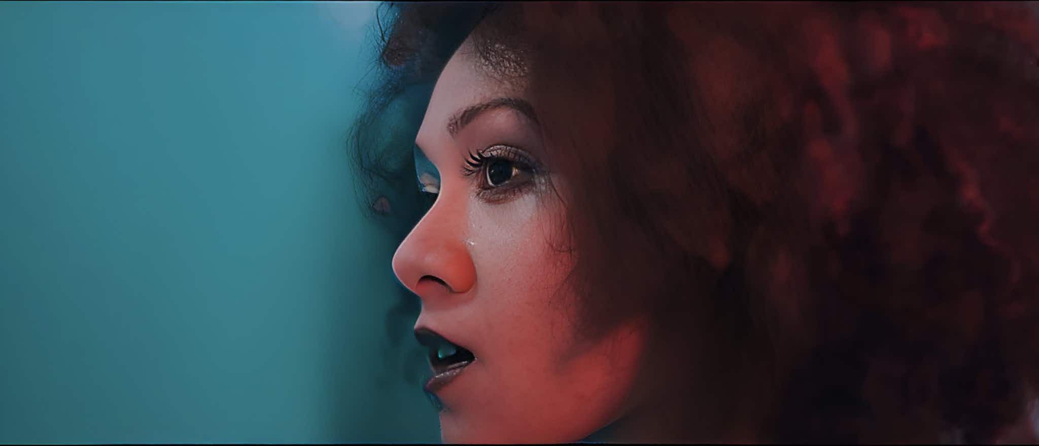 Women facing left on green background