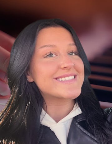 Piano teacher smiling with piano background