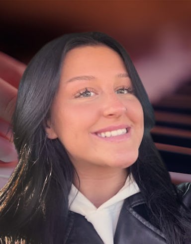 Piano teacher smiling with piano background