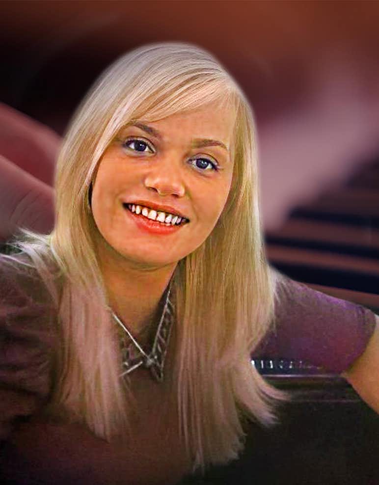 Piano Teacher Smiling with piano