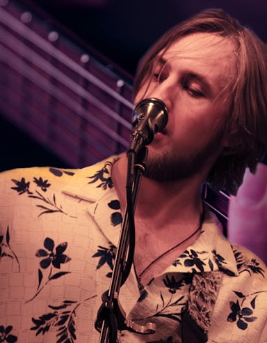 Man singing and playing guitar