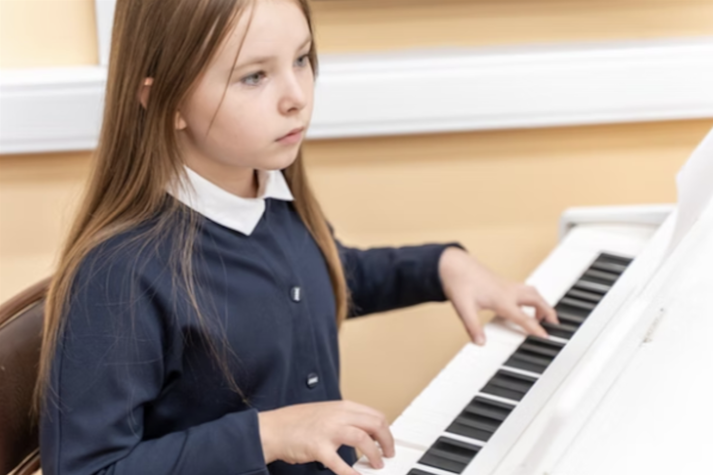  girl learning to play the piano