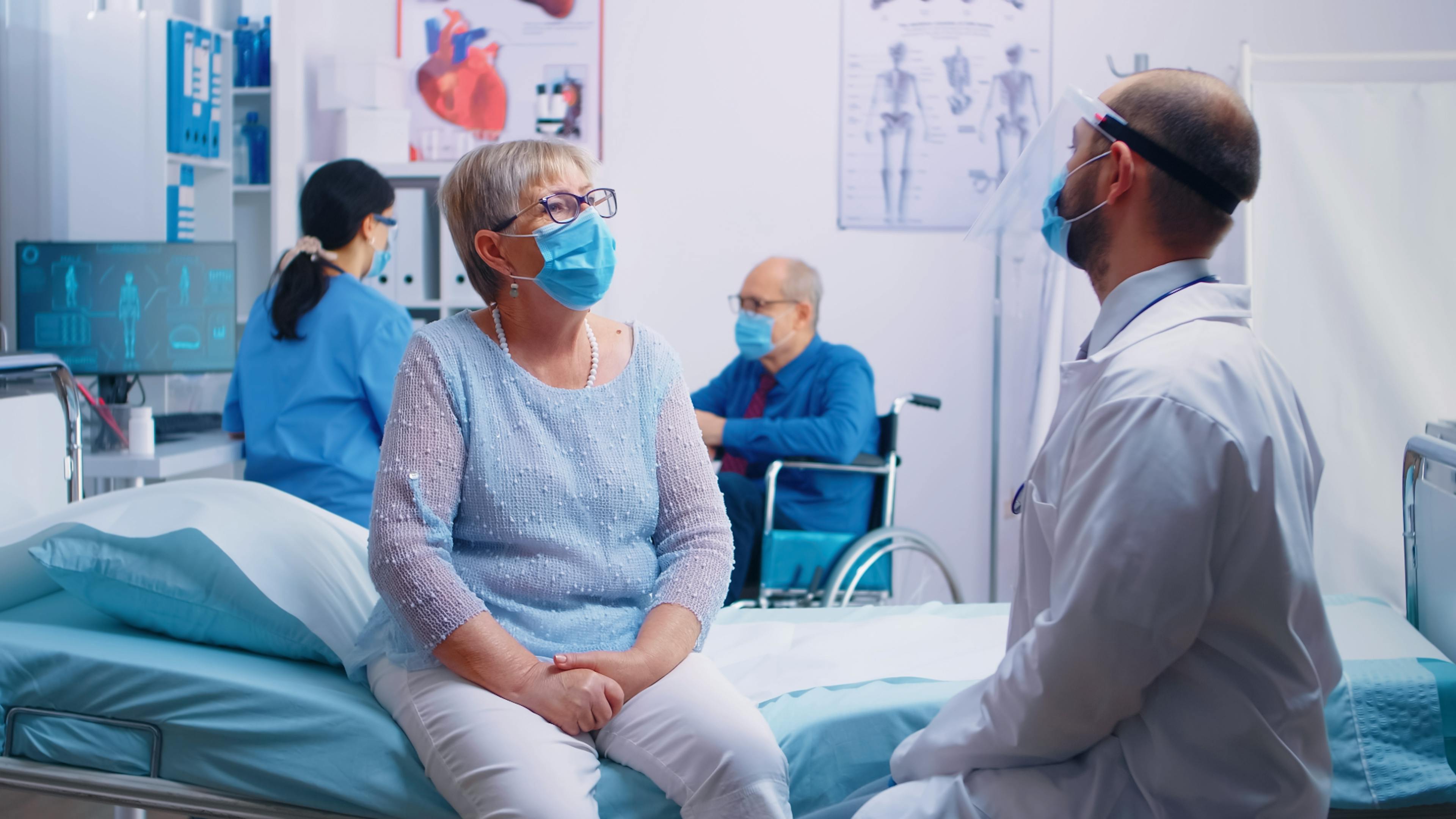 Hospital consultation between an older woman and her male doctor