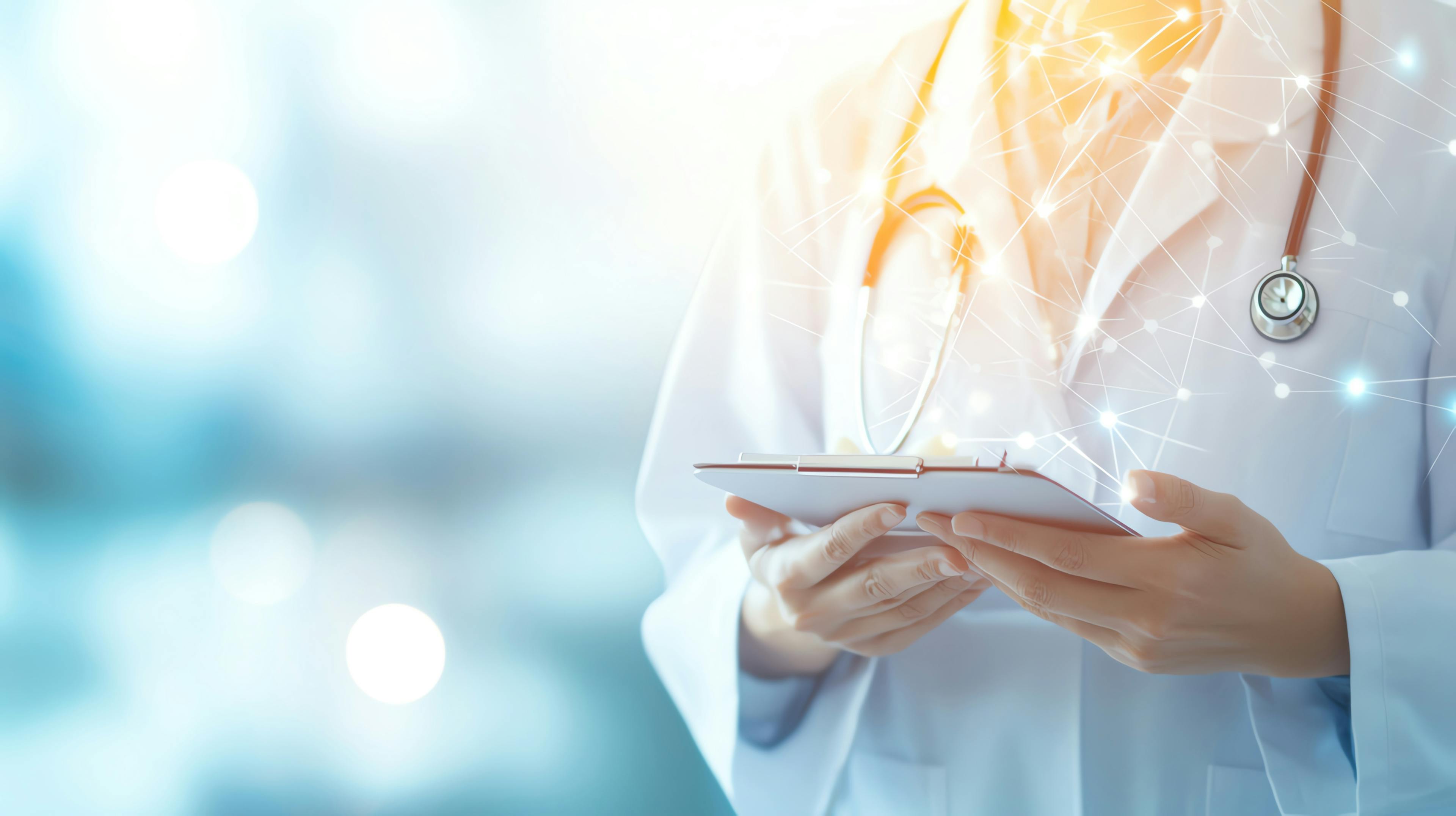 A healthcare professional using a tablet in a modern clinic, showcasing technology in medicine and patient care. Healthcare AI concept.