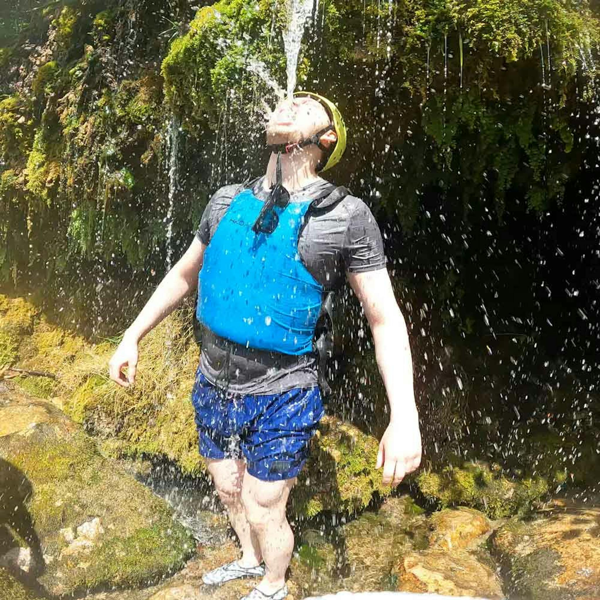 drinking spring water on river cetina on rafting trip