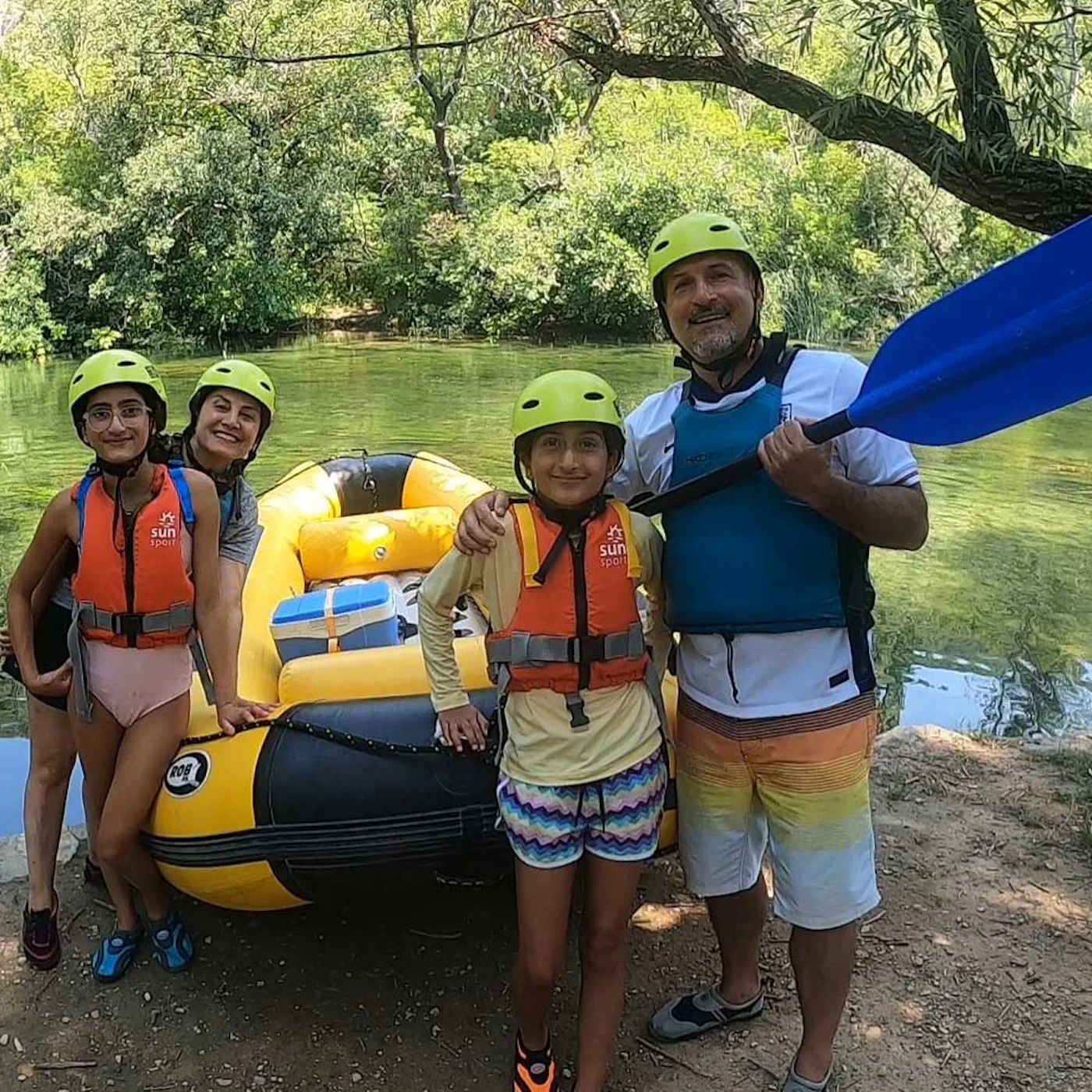 family on a boat on cetina river rafting trip