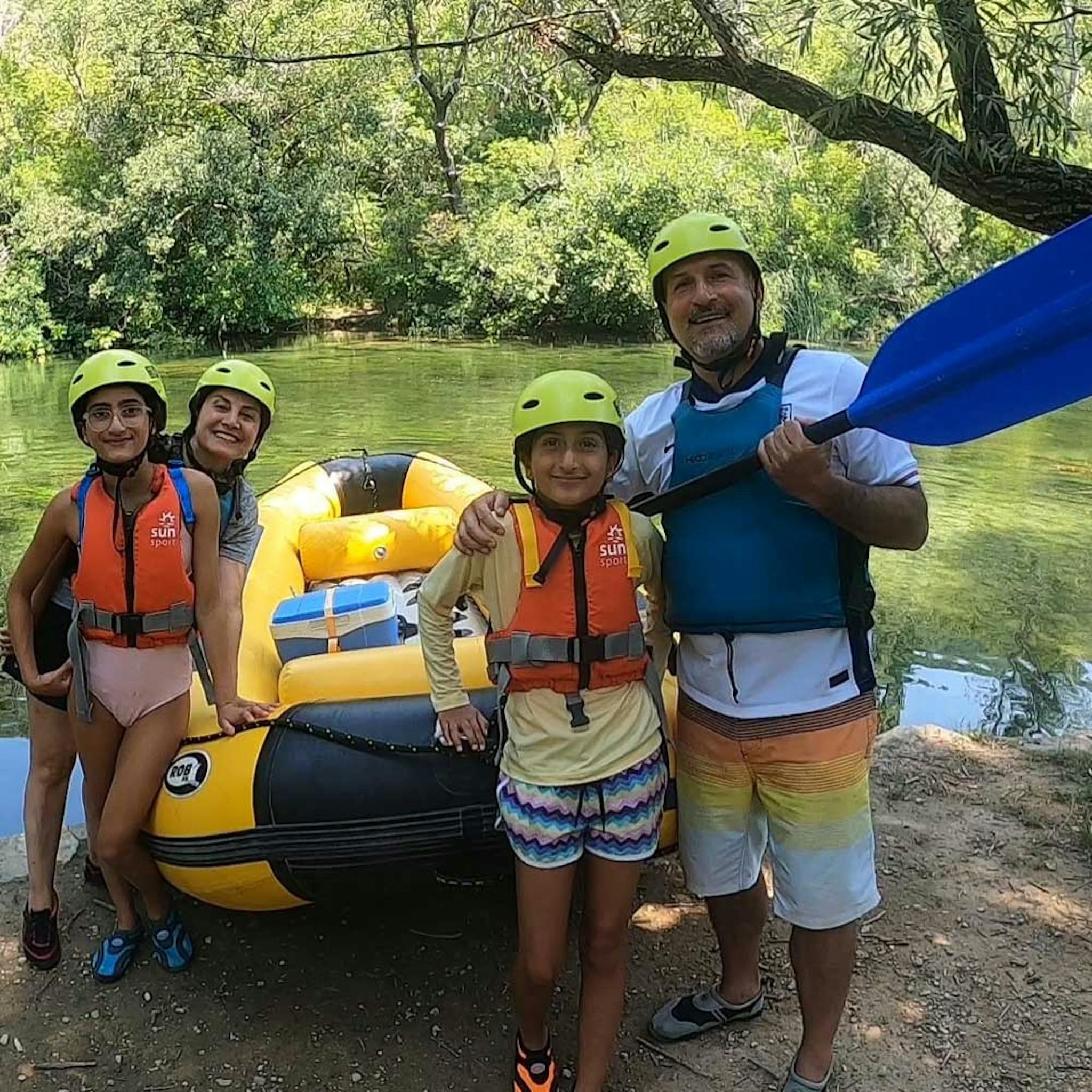 family on a boat on cetina river rafting trip