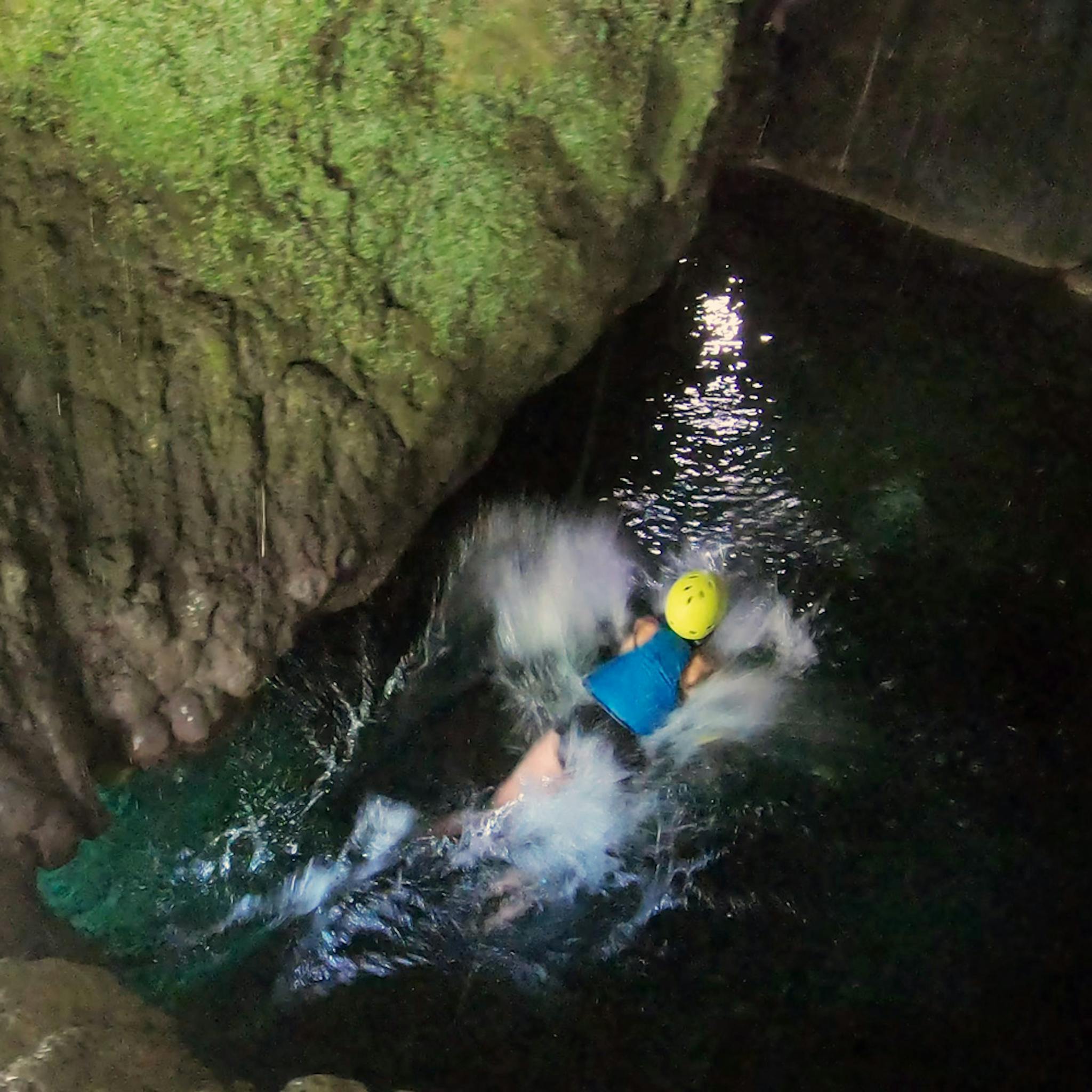 swimming in spring cave on river cetina on rafting trip