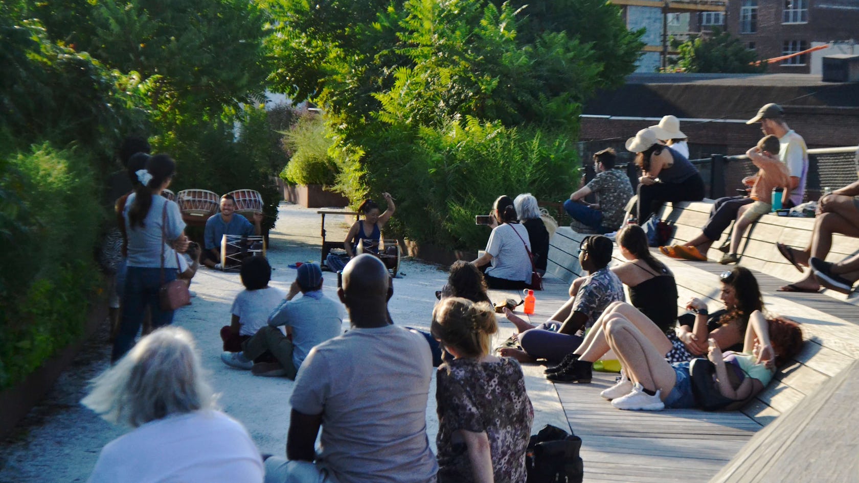 A crowd watches at drummers play