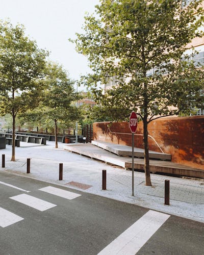 An image of the ramp entrance to the Rail Park. The Story Wall and seating platforms are visible to the right. 