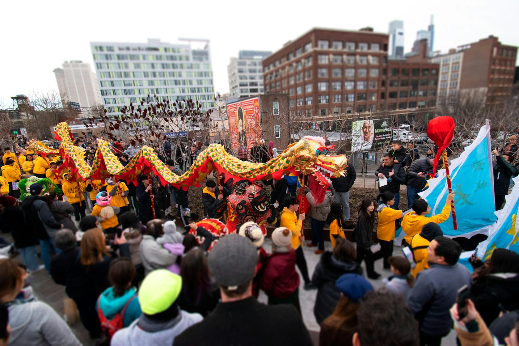 Lion Dancers perform in front of a crowd at the Rail Park