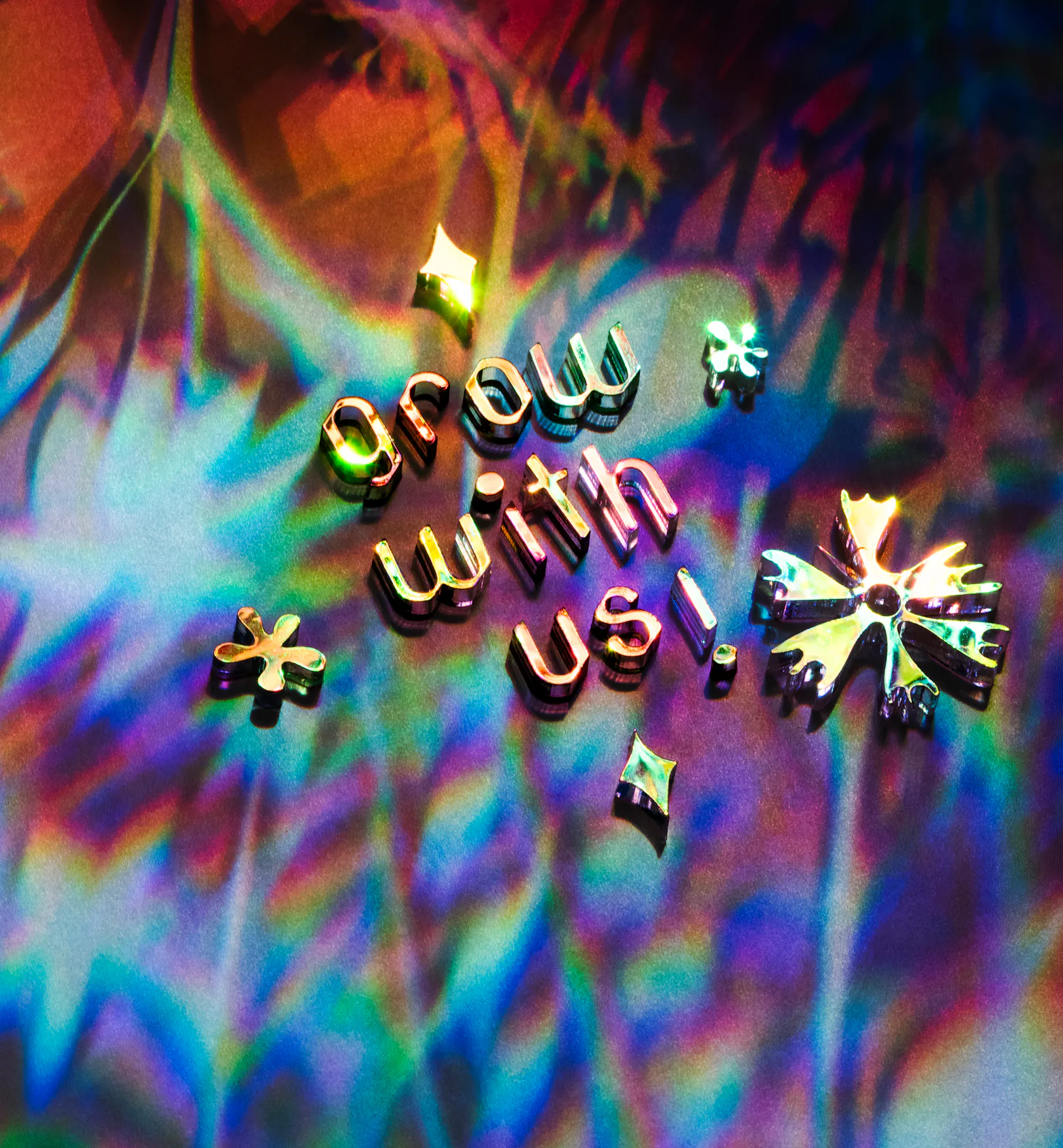 prismic image of flowers with text that says Grow with Us!