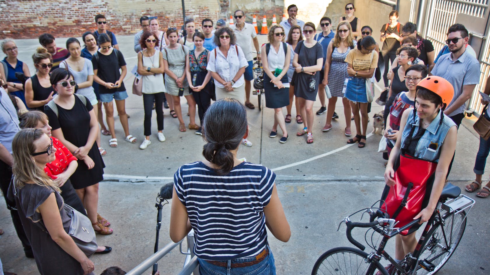 Person addressing a group of people.