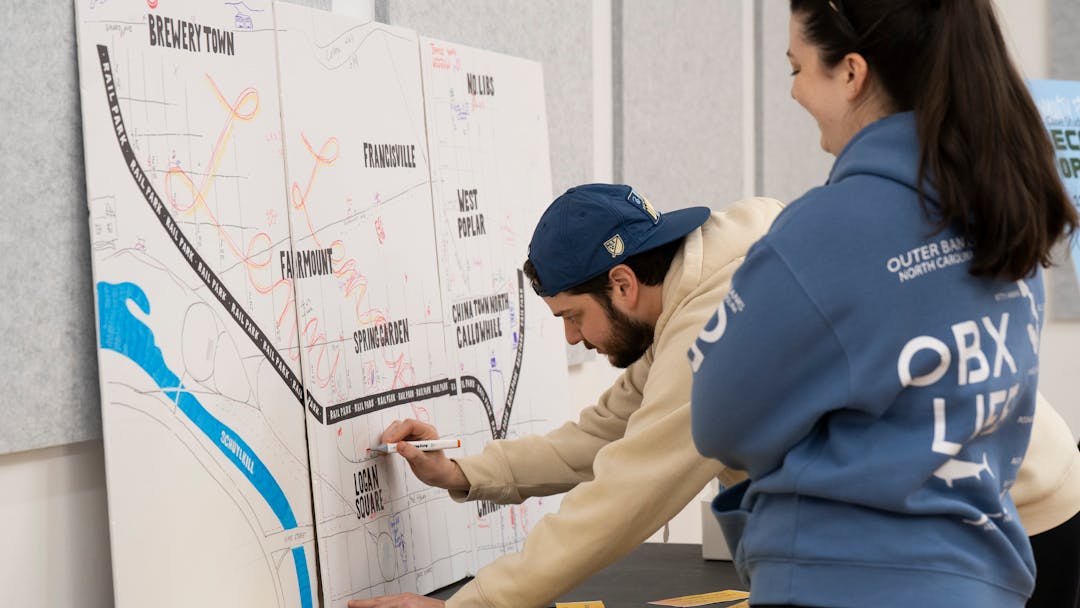 Two people participating in a community engagement activity