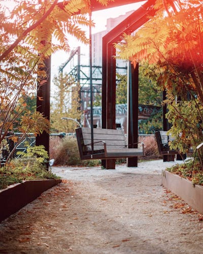 An image of the large, industrial looking swings made of wood and metal at Phase One of the Rail Park