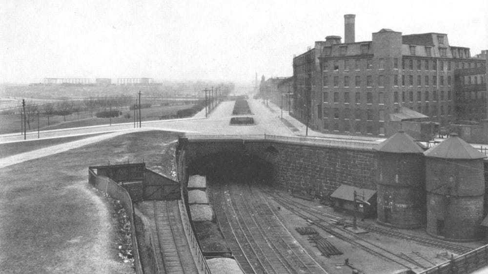 Black and white image of the East Entrance of the Tunnel. In the background, the Philadelphia Museum of Art is under construction.