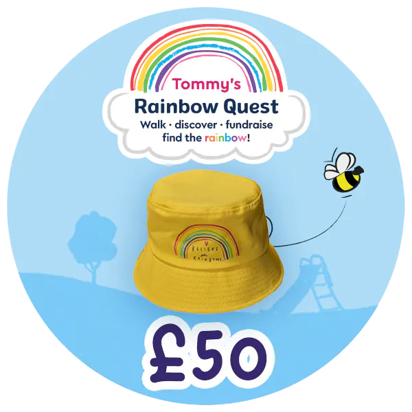 £50 prize badge includes a photo image of a yellow bucket hat with a rainbow on the front and text that says believe in rainbows.