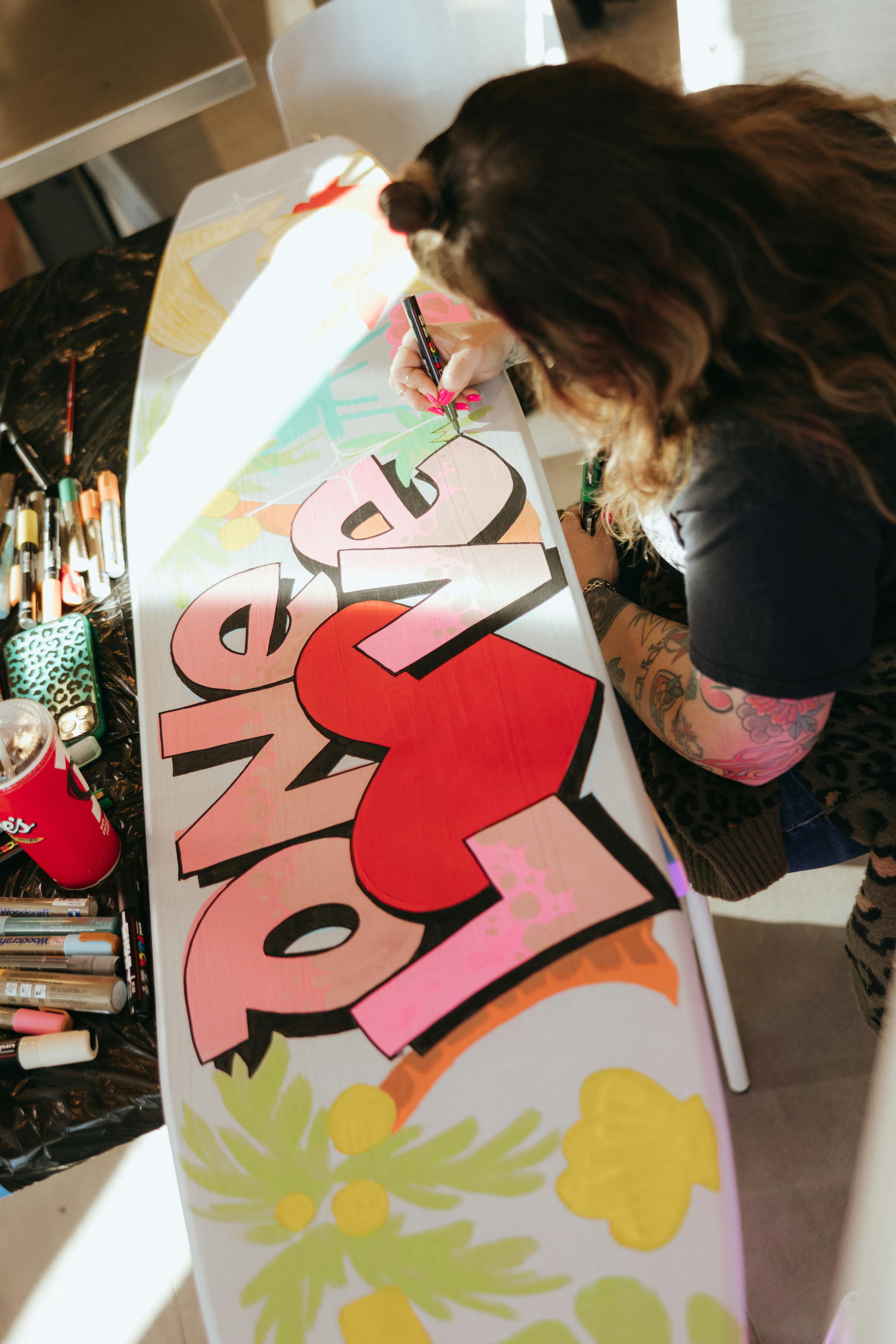 Delvs, a local Miami graffiti artist, creating a custom art piece for the grand opening