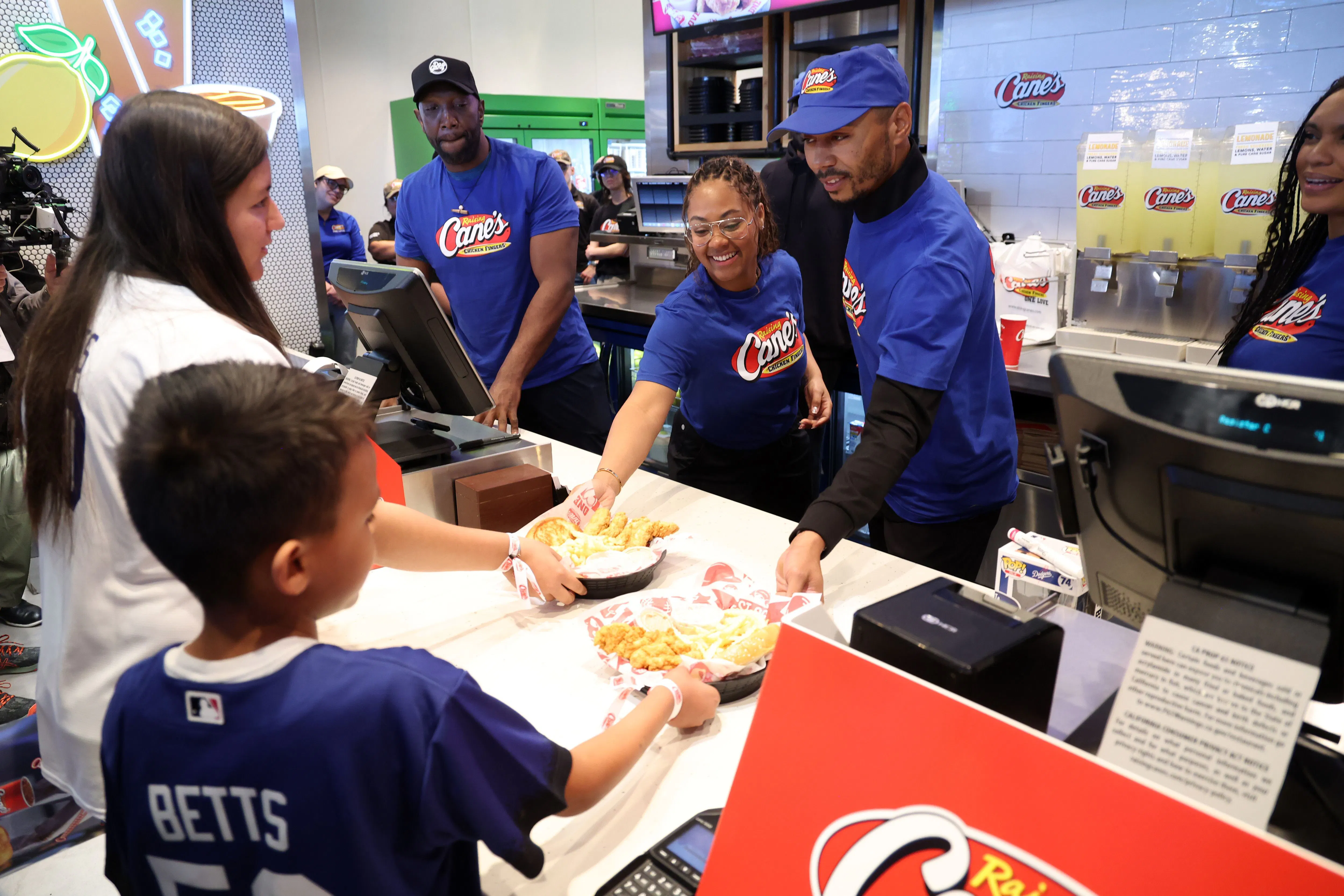 Mookie Betts serving customers