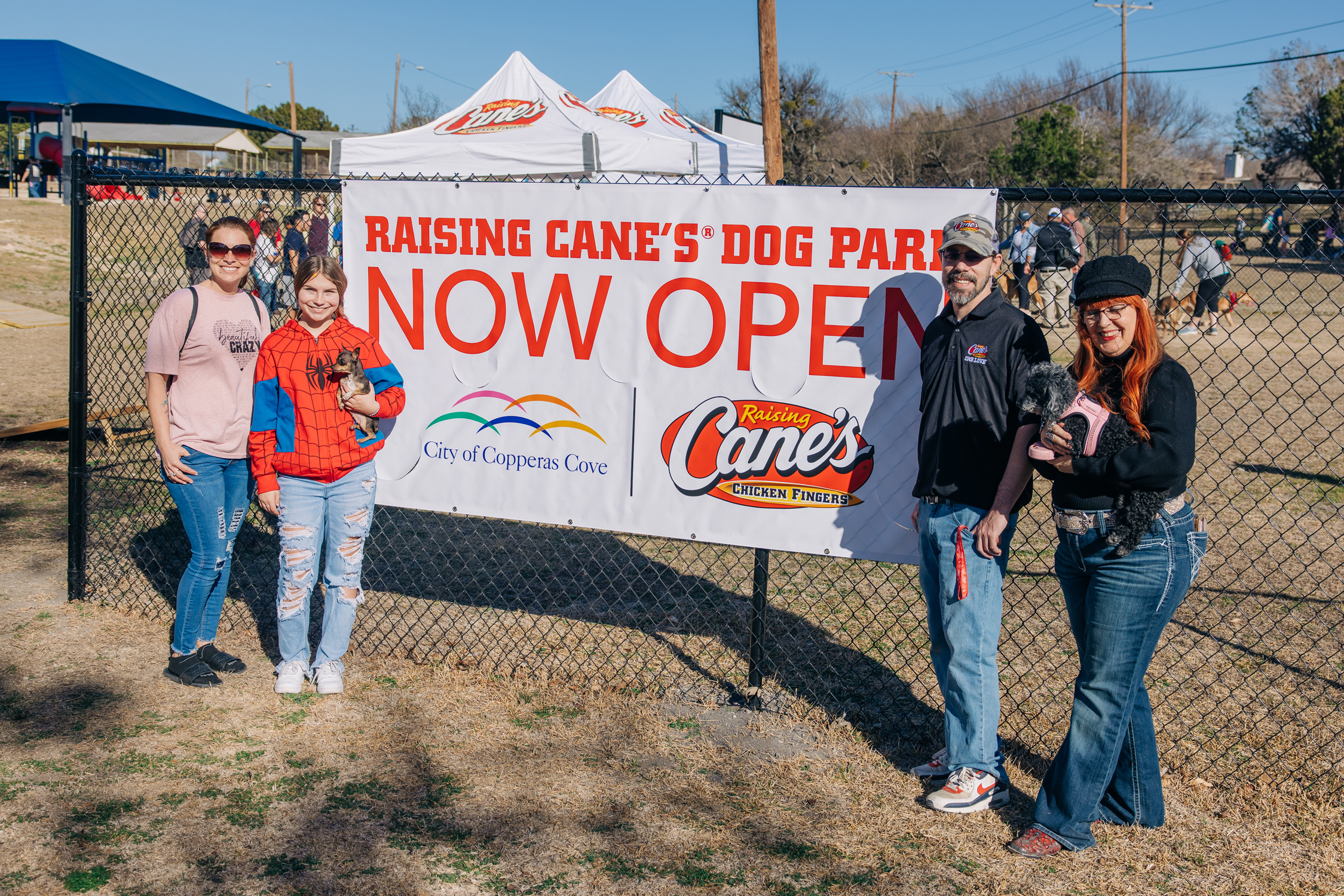 Owners and dogs at Raising Cane's dog park