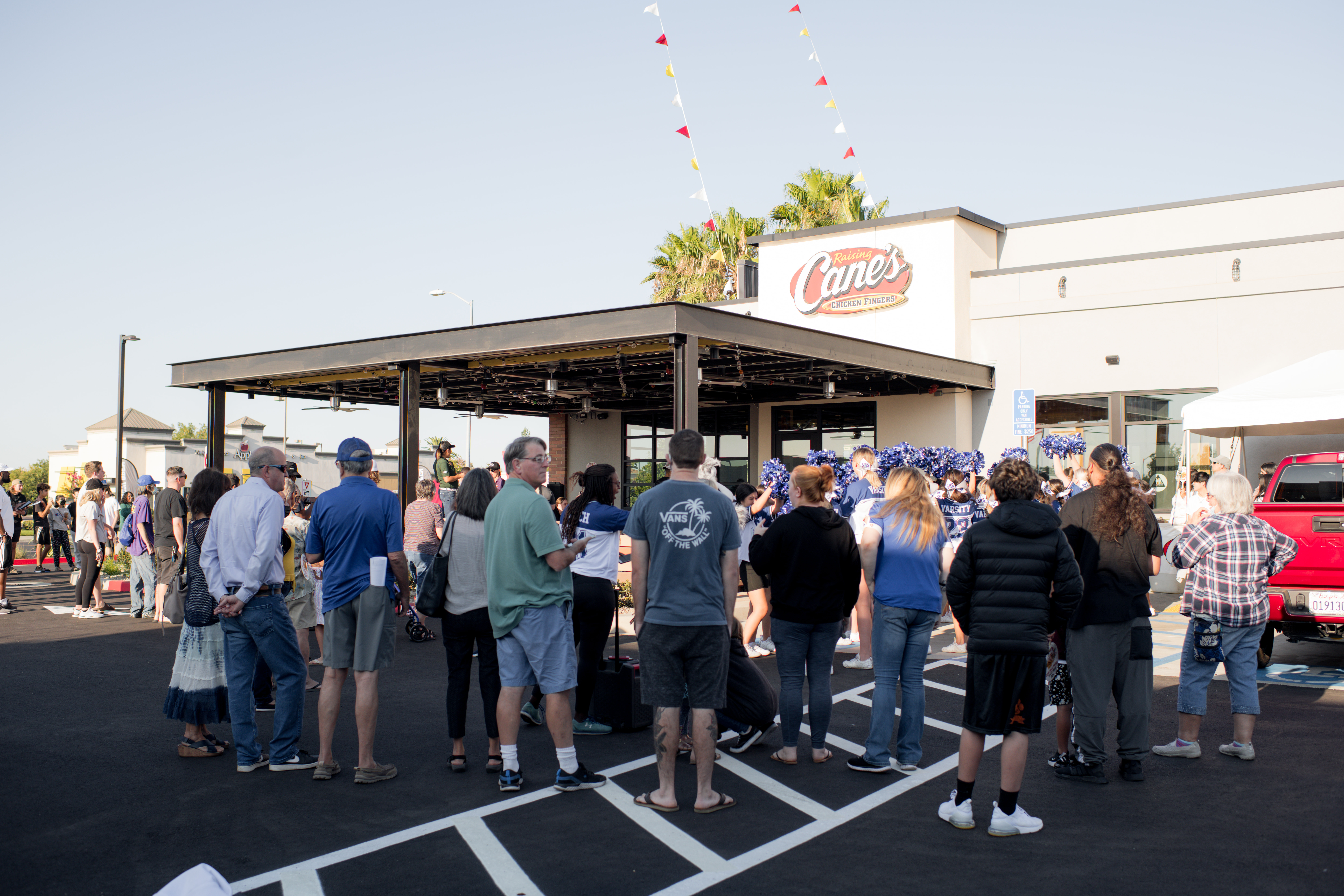 Customers waiting outside Raising Cane's