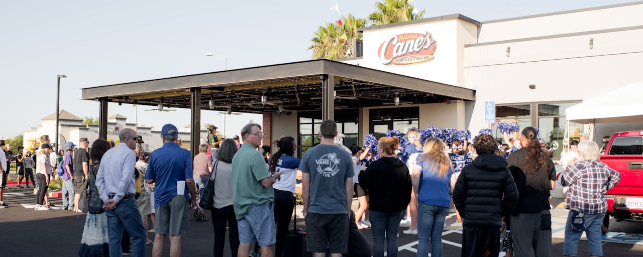 Customers waiting outside Raising Cane's