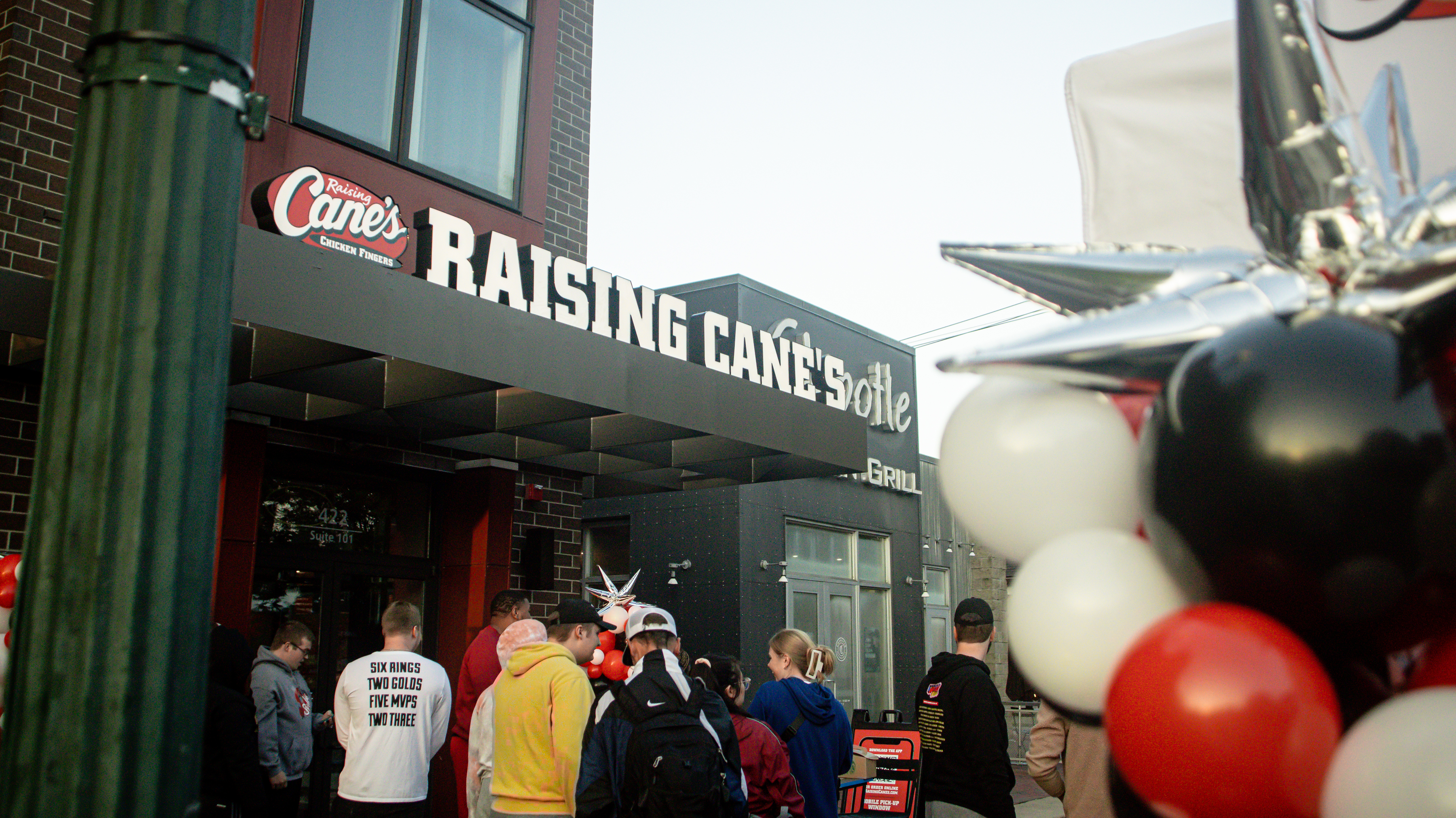 Customers waiting outside Raising Cane's